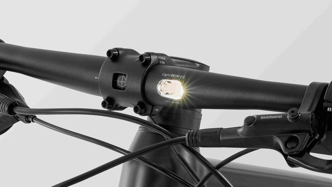 Canyon Roadlite:ON Handlebar with Integrated Light Close-up of Canyon Roadlite:ON handlebar showing integrated front light and Shimano brake system